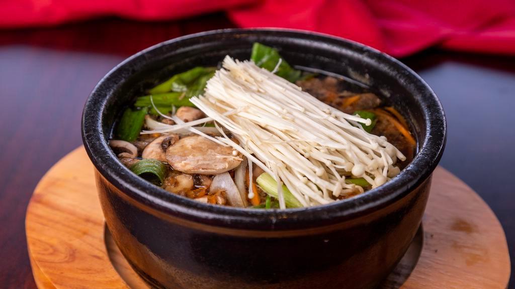 11. Ddook Bae Gi Bul Go Gi · Rib eye beef soup in hot stone bowl