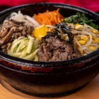 42.  Beef Dolsot · Beef, Vegetables & Egg over rice in Hot Stone Pot