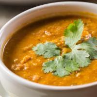 Dahl Soup · Lentils cooked with garlic, onions, and fresh tomatoes.