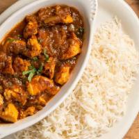 Korma Chicken · Chicken cooked with fresh tomatoes and garlic. Served with white rice.