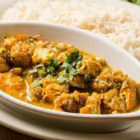 Chicken Curry · Boneless chicken cooked with a delicious curry sauce. Served with white rice.