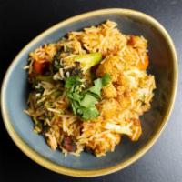 Vegetable Biryani · Vegetarian. Saffron flavored basmati rice with vegetables and nuts.
