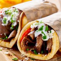 Lamb Gyro · Thin marinated slices of lamb gyro meat, lettuce, tomatoes, onions topped with tzatziki sauc...