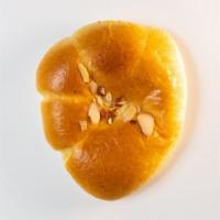 #57. Custard Bun · Sweet bun with custard cream filling. Contains: Egg, Wheat, Milk, Tree Nut(almond), and Soy