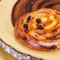 Pain Aux Raisin · Twisted buttery pasty with raisins.
Contains: Wheat, Milk, and Egg *May Contains: Traces of ...