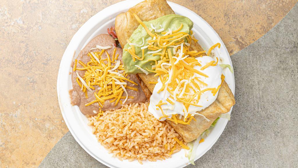 20. Chimichanga Plate · Includes choice of 4 pieces of corn or 2 pieces of flour tortilla. includes rice and beans.