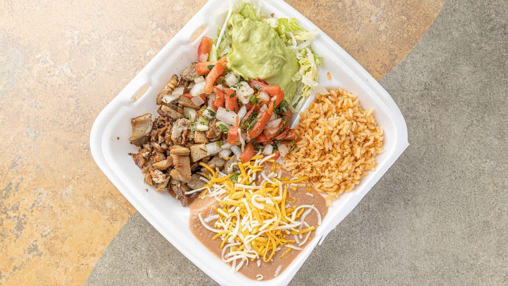 16. Carnitas Plate · Includes choice of 4 pieces of corn or 2 pieces of flour tortilla. includes rice and beans.