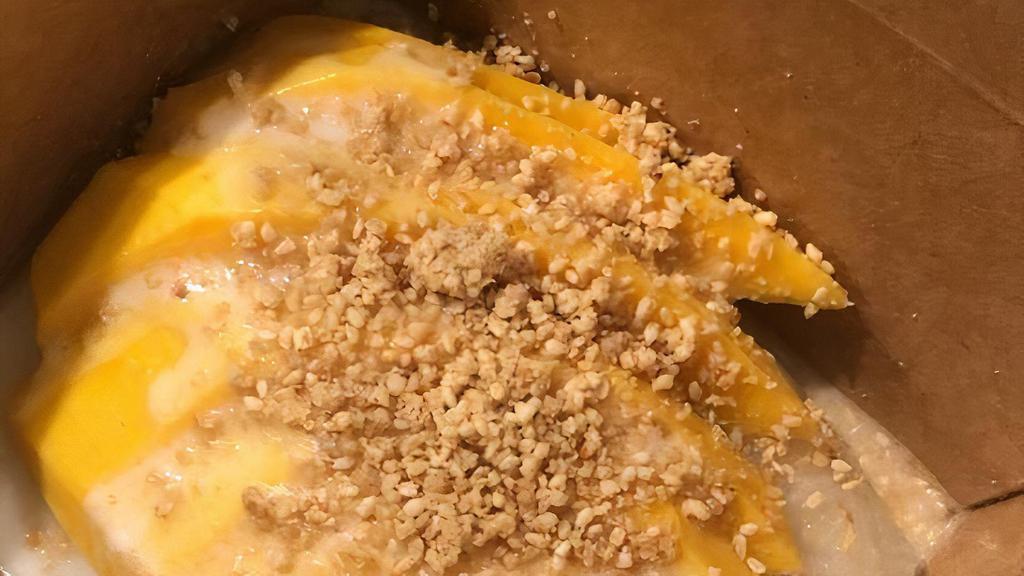 Mango and Sticky Rice · Sticky rice with sweet coconut milk and topped with fresh mangoes, coconut cream sauce and toasted sesame seeds