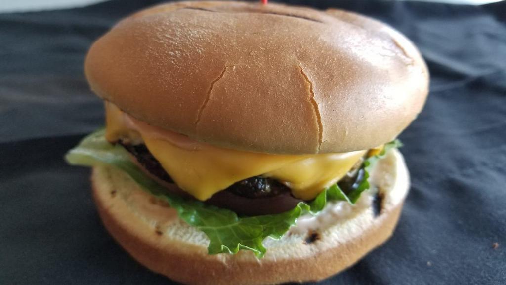 Lamb & Beef Burger · Lamb & Beef patty served in a Brioche bun with lettuce, tomatoes, and homemade burger sauce. Add cheese for an extra charge.