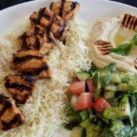 Chicken Kabob Plate · 6 pieces of chicken kabob served on a bed of rice alongside a serving of house salad, hummus...