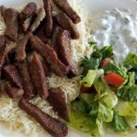 Gyro Plate · Sliced lamb & beef gyro served on a bed of rice alongside a serving of house salad, tzatziki...