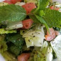 House Salad · Lettuce, tomatoes, and cucumbers mixed with our House dressing.
