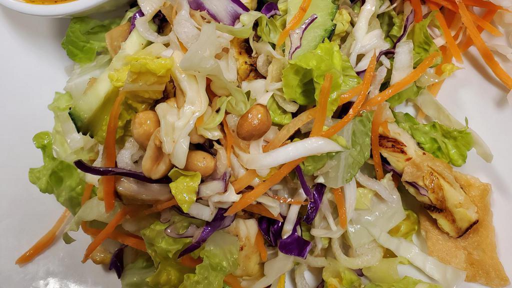 Thai Crunch Salad · Our signature salad romaine lettuce, cucumber, peanuts, carrot and red cabbage tossed with special peanut dressing.