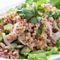 Chicken Salad · Minced chicken mixed with chopped onion, lime juice, and crushed tossed rice served with org...