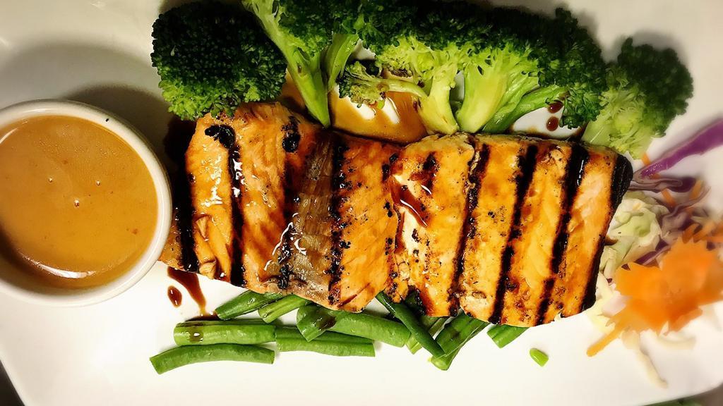 Salmon Satay · Grilled marinated salmon satay served with steamed broccoli and carrot with peanut sauce.