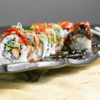 Dragon Roll · Tempura shrimp kyu top with ell avocado tobiko scallion and eel sauce.
