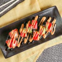 Lilly Roll · Tempura shrimp sweet potato top with tuna avocado and eel sauce and spicy mayo. Consuming ra...