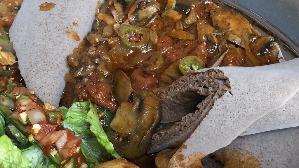 Mushroom Tibs · Vegetarian. Vegan. An excellent additional to plate with hearty meat like mushroom sauce cooked with onion, tomato, garlic and rosemary.