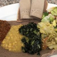 Ethiopian Vegetarian Combo · Vegetarian. Butticha misir (red lentils) wot, kik alicha (split peas), gomen (collard greens...