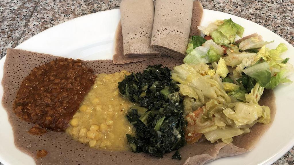 Ethiopian Vegetarian Combo · Vegetarian. Butticha misir (red lentils) wot, kik alicha (split peas), gomen (collard greens), atikilt and tomato firfir.