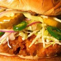 Fried Chicken Sandwich · Topped with pepper Jack cheese and apple cider slaw.