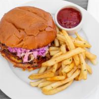 Pulled Pork Sandwich · Pulled pork with our house made BBQ sauce, topped with apple cider slaw.