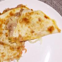 Quesadilla · Prepared with 2 tortillas, stuffed with cheese, topped with refried beans and more cheese an...