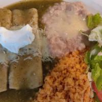 Enchiladas Virdes · 2 cheese, beef or chicken enchiladas sheered in our tangy green tomatillo sauce and topped w...