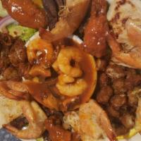 Parrillada · Include oysters, shrimps, octopus and scallops in a special recipe hot sauce shrimps grilles...