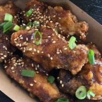 Soy Garlic Wings 5Pc · Seasoned wings tossed in a soy garlic sauce, topped with green onions and sesame seeds