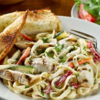 Fettuccine Chicken Alfredo · Served with carrots, zucchini & red bell peppers.