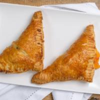 Savory Turnover - Sausage & Cheddar · Delicious puff pastry filled with sausage and cheddar cheese.