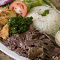 Combo Doner Plate · Combination of chicken, lamb and beef doner. Served with rice, salad and pita bread.