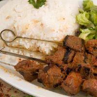 7. Beef Kebab Plate · Tendered, broiled, marinated thin beef skewers. Served with rice, salad and pita bread.