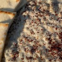 Baba Ghanoush · A delightful dip of charbroiled eggplant.
