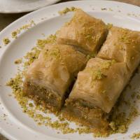 Baklava · Pastry made of flaky phyllo dough, filled with chopped and sweetened nuts, and topped with s...