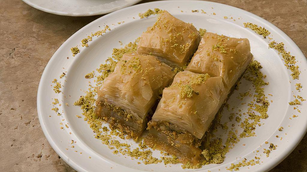Baklava · Pastry made of flaky phyllo dough, filled with chopped and sweetened nuts, and topped with syrup