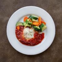 Lasagna · Homemade with mushrooms, ground beef, pork, and three cheeses, served with sautéed vegetables