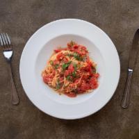 Cappellini Pomodoro · Tomatoes and fresh basil sautéed with garlic and olive oil