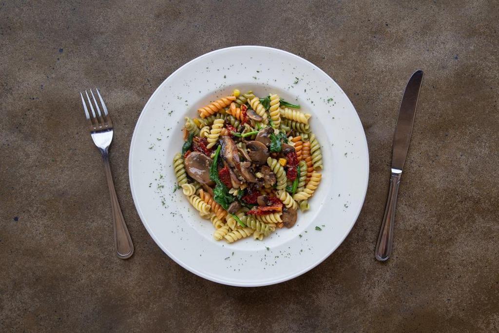 Portabella Fusilli · Portabella and criminology mushrooms, spinach, sun dried tomatoes, and sweet corn tossed in a roasted garlic marsala sauce with a touch of cream.