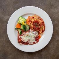 Eggplant Parmesan · Sliced and breaded eggplant in marinara sauce with fresh basil and parmigiana, served with s...