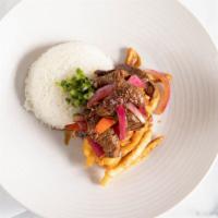 Lomo Saltado Bowl · Choice of protein with sauteed onions, tomatoes, soy sauce blend, over french fries and jasm...