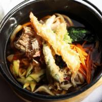 Nabe Udon · Vegetables, chicken, seafood with shoyu based broth in a pot.