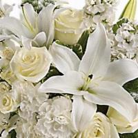 Teleflora's Shimmering White Bouquet · All is calm, all is white in this exquisite bouquet featuring white roses, lilies, alstroeme...