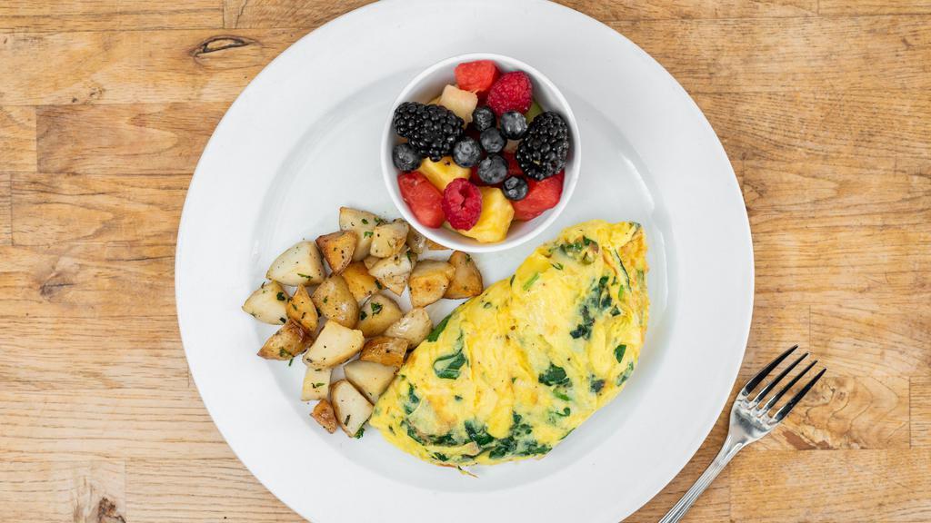 Spinach & Gruyere Omelet · Sautéed  baby spinach with Gruyere cheese, served with oven roasted rosemary potatoes and mix fruit  
 Add bacon or chicken apple sausage.