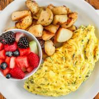 Fine-Herbs Omelet · Mixture of herbs , thyme and rosmery . served with oven roasted rosemary potatoes and mix fr...