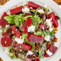 Beet Salad · Organic baby spinach, red beets, toasted hazelnuts and goat cheese with valencia orange vina...