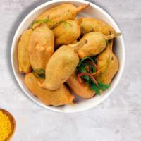 Taste of Pakora · Assorted vegetables dipped in a light batter and fried until golden brown.