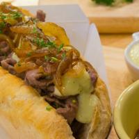 The Crispy Bacon Philly Cheesesteak Sandwich · Juicy, chopped steak with your choice of melty cheese, grilled onions, and peppers and crisp...