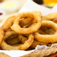Beer Battered Onion Rings · Thick cut, beer battered onion rings fried until golden and crispy.